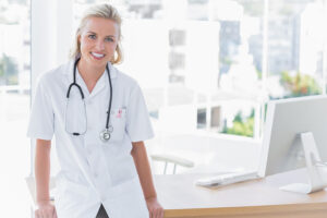 Nurse Educator standing at desk